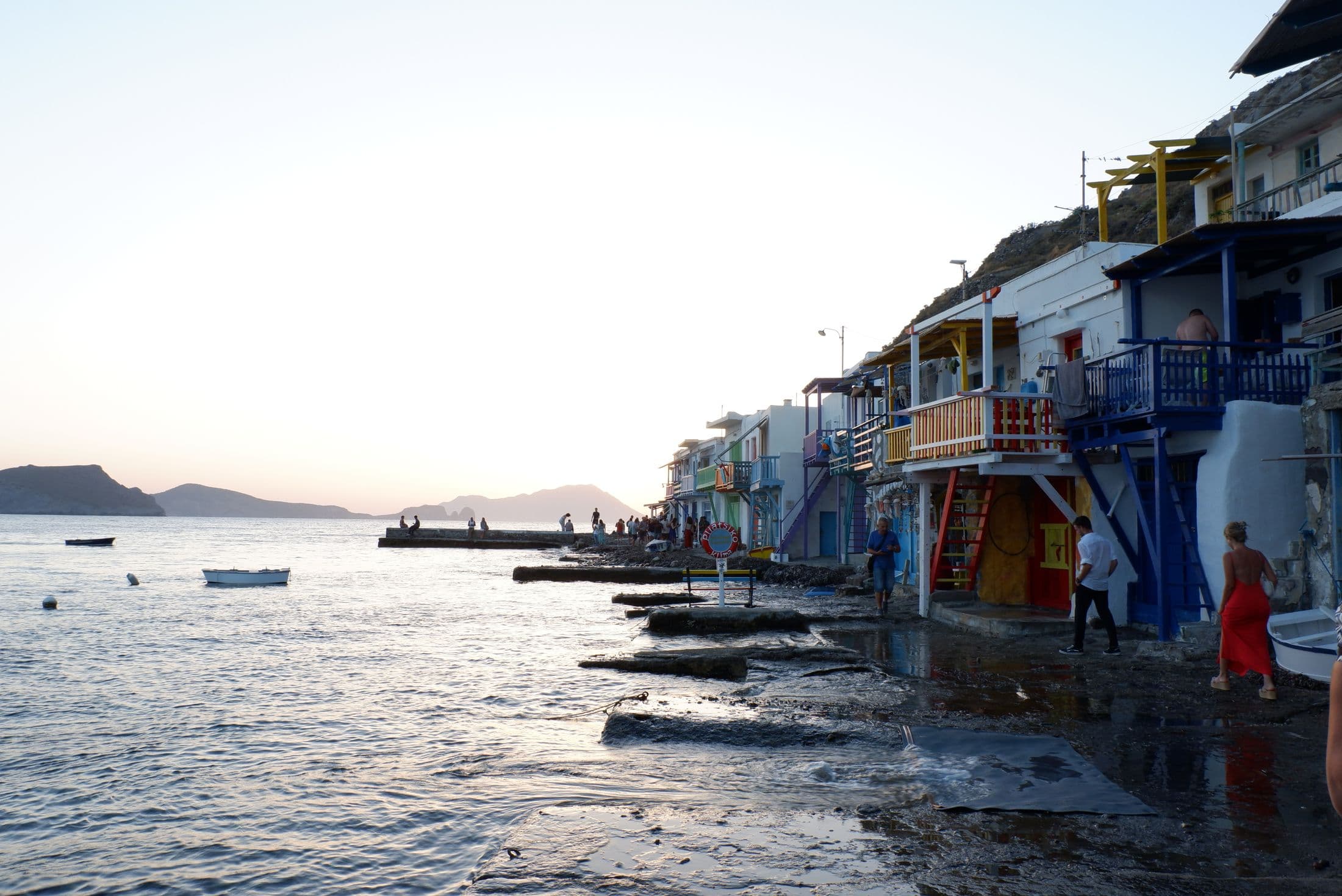 Colourful houses of Klima village at the water's edge at sunset, Milos
